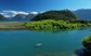 People fly fishing on a small boat on a river in Patagonia.
